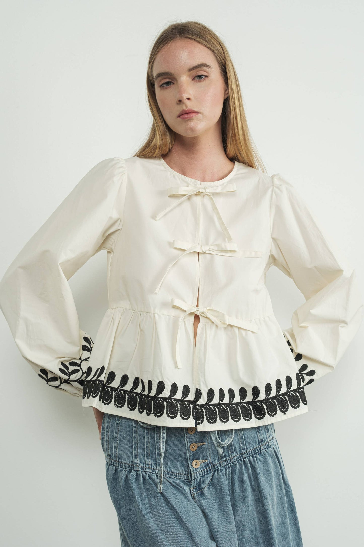 Embroidered Bow Tie Peplum Top