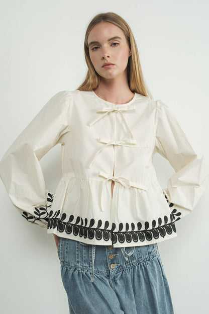 Embroidered Bow Tie Peplum Top