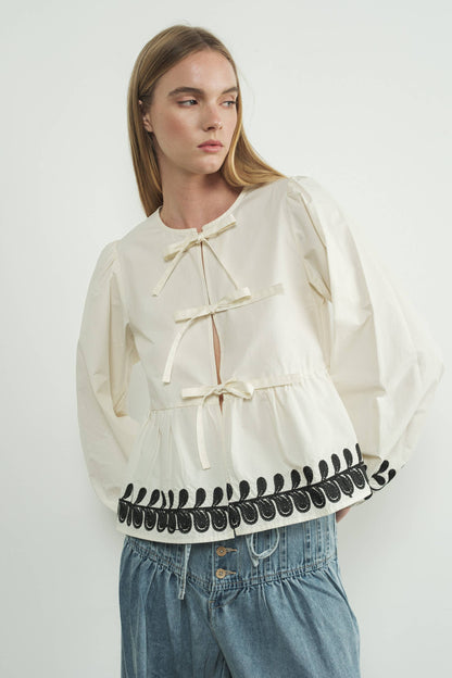 Embroidered Bow Tie Peplum Top