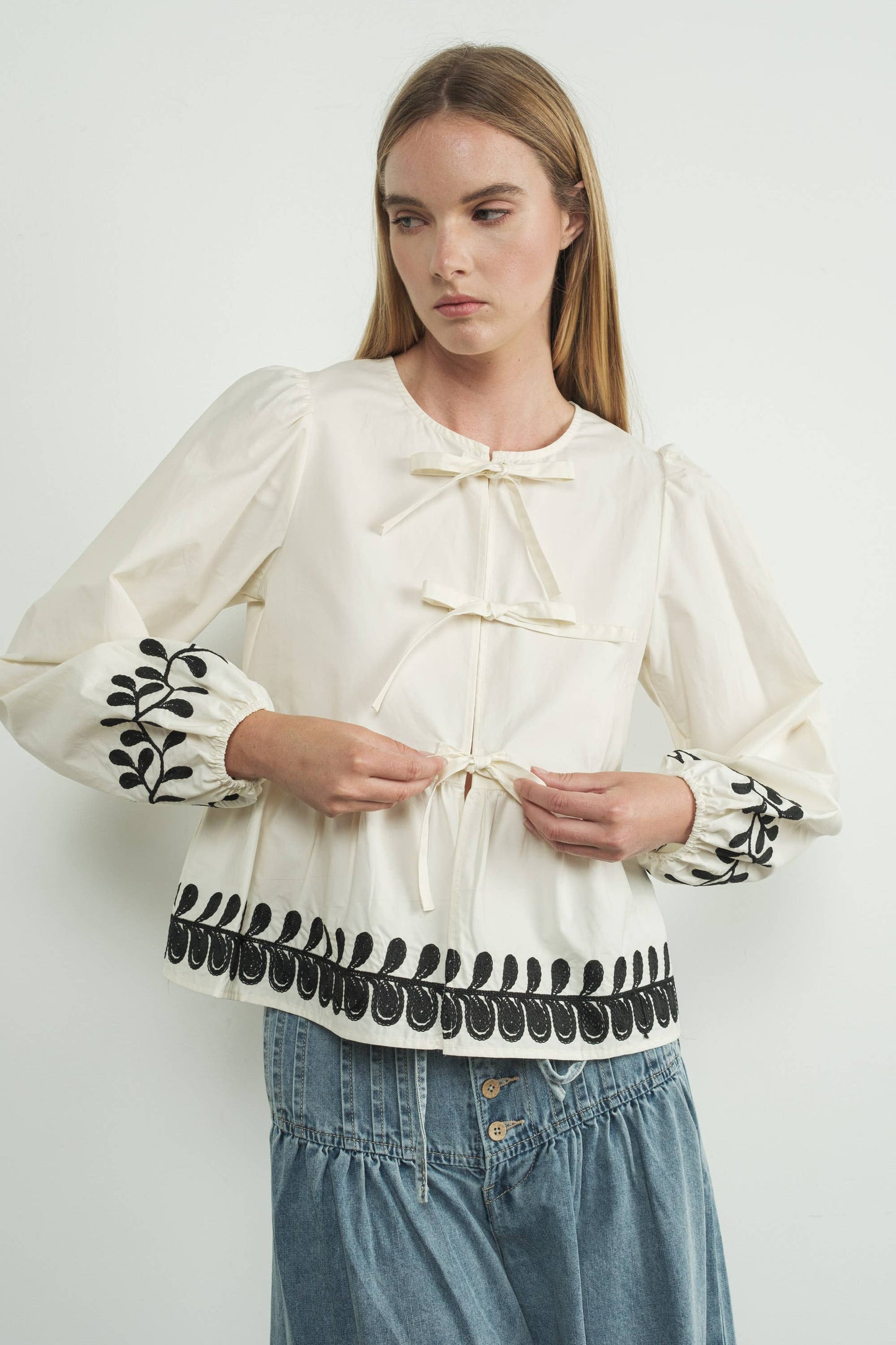 Embroidered Bow Tie Peplum Top